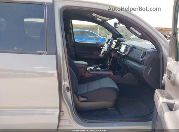 3TMAZ5CN2PM213988 2023 TOYOTA TACOMA Green Widok wnętrza z przodu