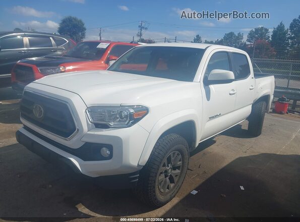 3TMAZ5CN9MM148116 2021 TOYOTA TACOMA White Vista tres cuartos delantera izquierda
