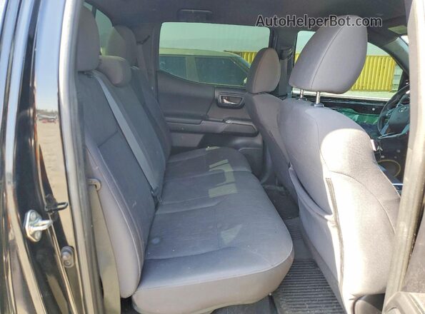 3TMAZ5CNXKM107698 2019 TOYOTA TACOMA Black Vista de los asientos traseros