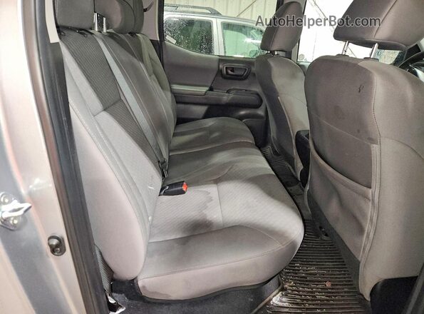 3TMCZ5AN2PM613786 2023 TOYOTA TACOMA Silver Rear interior view