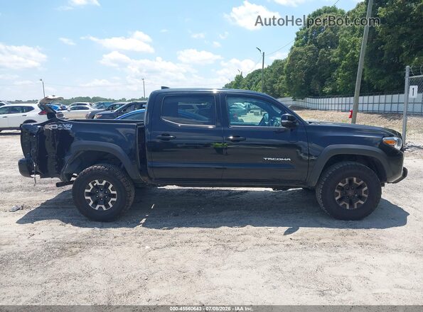 3TMCZ5AN4PM628421 2023 TOYOTA TACOMA Black Вид задньої частини салону