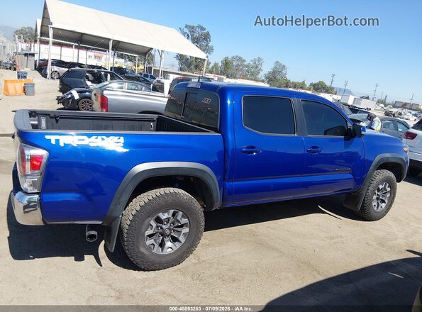 3TMCZ5AN4PM652072 2023 TOYOTA TACOMA Blue Вид задньої частини салону