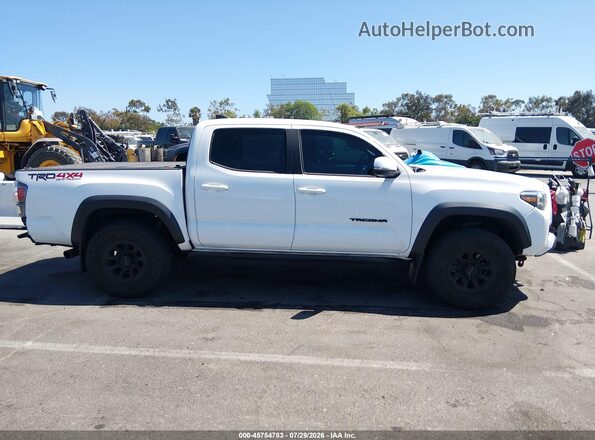 3TMCZ5AN5PM593744 2023 TOYOTA TACOMA Белый Вид задней части салона