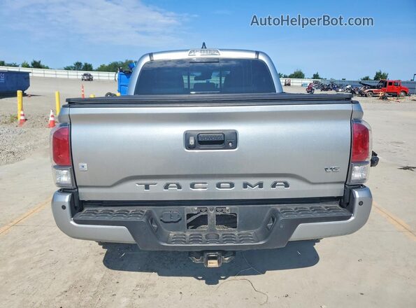 3TMCZ5AN9PM570435 2023 TOYOTA TACOMA Silver Rear view