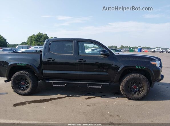 3TMCZ5AN9PM655047 2023 TOYOTA TACOMA Black Rear interior view