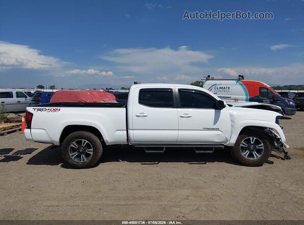 3TMDZ5BN4JM053988 2018 TOYOTA TACOMA White Vista interior trasera