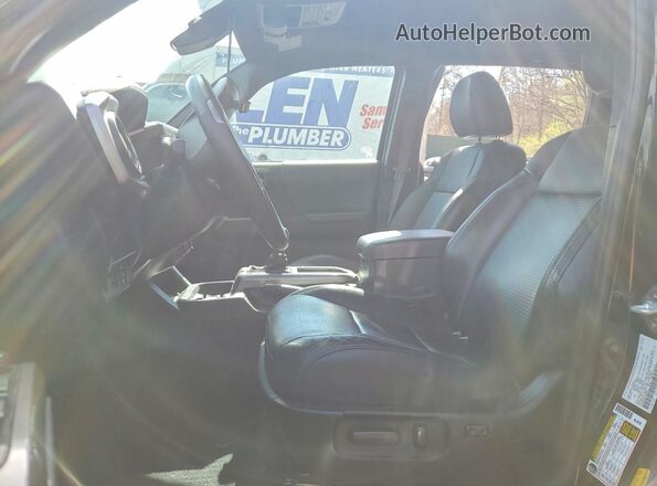 3TYHZ5BN4PT020407 2023 TOYOTA TACOMA Black Widok wnętrza z przodu