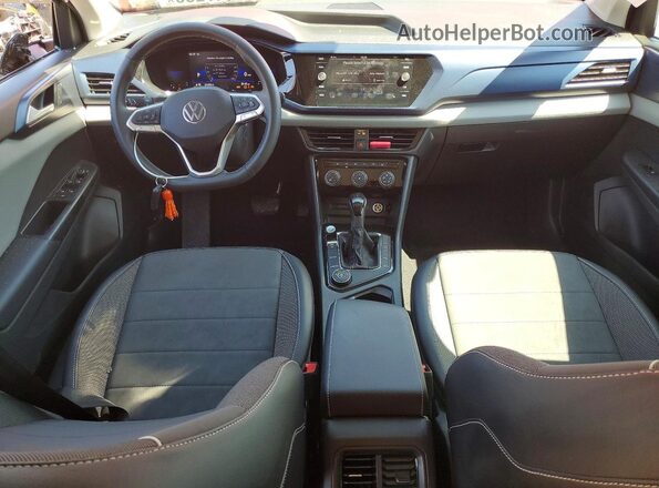3VVNX7B24PM300609 2023 VOLKSWAGEN TAOS Red Dashboard view