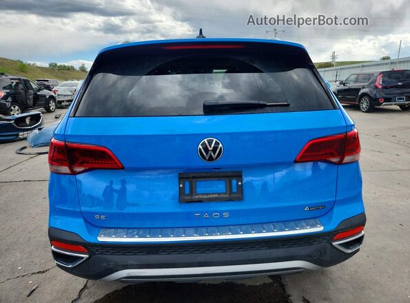 3VVVX7B2XRM047007 2024 VOLKSWAGEN TAOS Blue Widok z tyłu