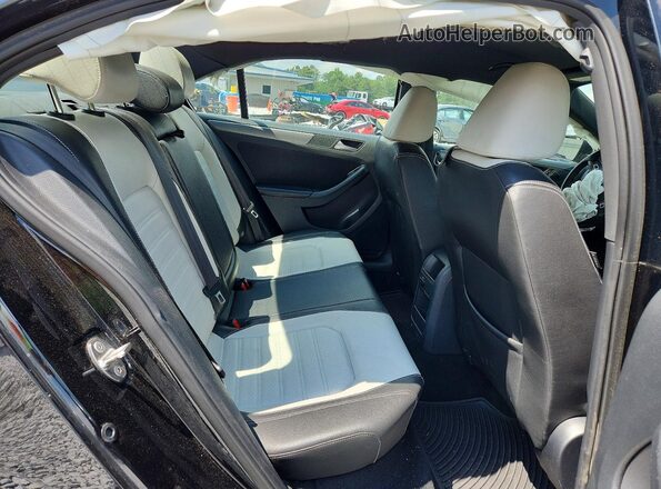 3VWD17AJ9GM294842 2016 VOLKSWAGEN JETTA Black Rear seats view