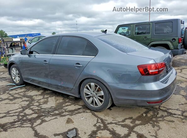 3VWD67AJ3GM205140 2016 VOLKSWAGEN JETTA Gray Trasero izquierdo