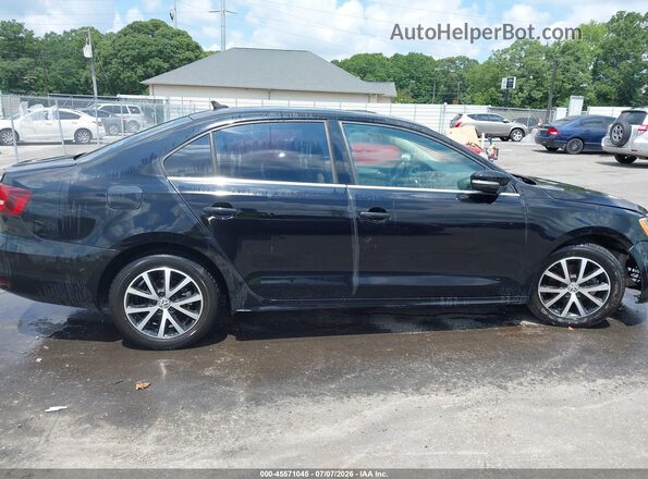 3VWDB7AJ4HM300738 2017 VOLKSWAGEN JETTA Black Rear interior view