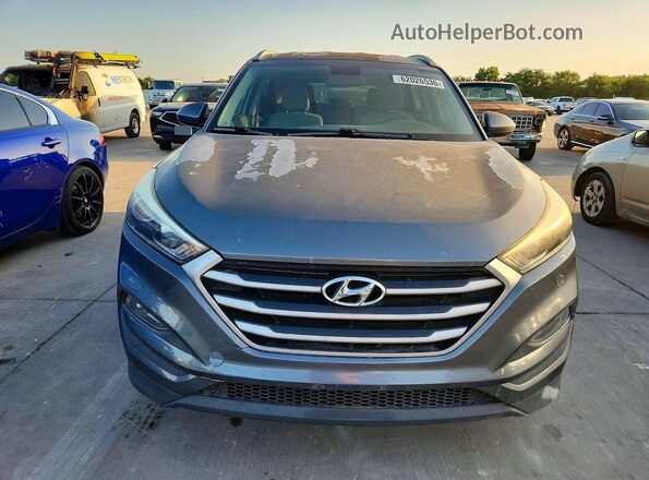 KM8J33A45JU663617 2018 HYUNDAI TUCSON Gray Rear view