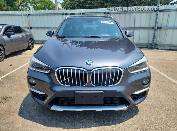 WBXHT3C30J5K25396 2018 BMW X1 Gray Rear view