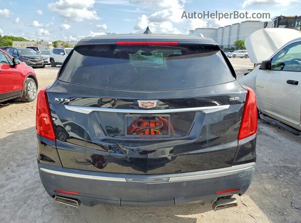 1GYKNCRS8HZ112031 2017 CADILLAC XT5 Black წინა სალონის ხედი