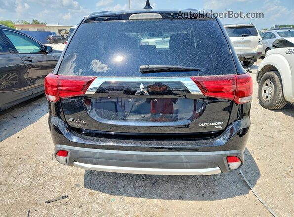 JA4AZ3A32JZ001470 2018 MITSUBISHI OUTLANDER Black Vista interior delantera