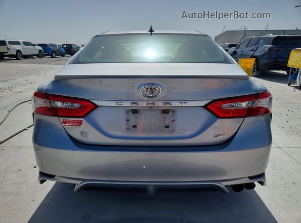 4T1B11HK5KU700329 2019 TOYOTA CAMRY Silver Rear view