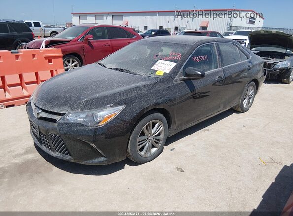 4T1BF1FK8GU188237 2016 TOYOTA CAMRY Black Vista tres cuartos delantera izquierda