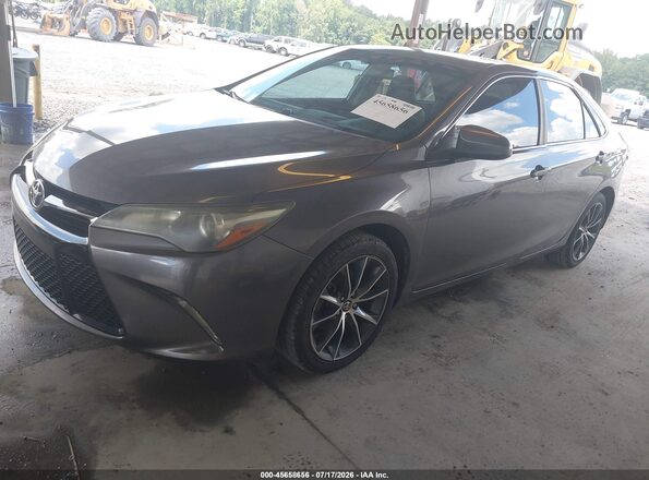 4T1BF1FK9GU516264 2016 TOYOTA CAMRY Gray Vista tres cuartos delantera izquierda