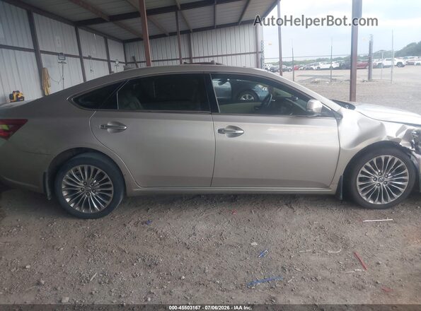 4T1BK1EB2GU231659 2016 TOYOTA AVALON Gold Widok wnętrza z tyłu