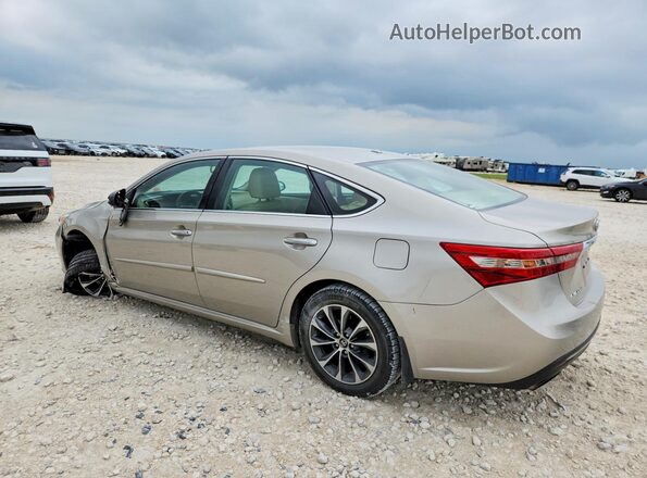 4T1BK1EB7GU217708 2016 TOYOTA AVALON Beige Trasero izquierdo