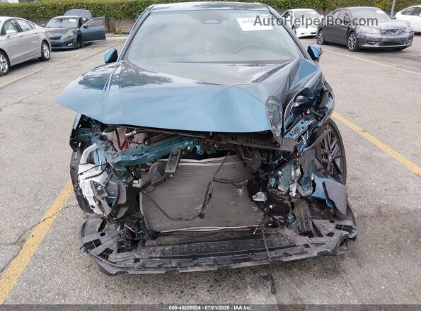 4T1DAACK5TU215979 2026 TOYOTA CAMRY Teal Սալոնի հետևի տեսք