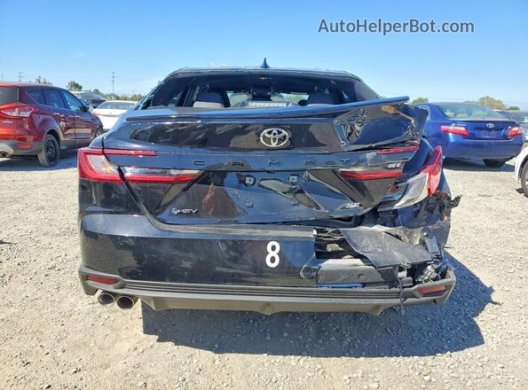4T1DAACK7SU204173 2025 TOYOTA CAMRY Black Rear view
