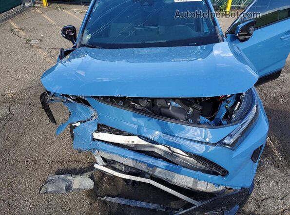 4T3T6RFV7NU104877 2022 TOYOTA RAV4 Blue Vista interior trasera