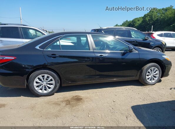 4T4BF1FK9GR524192 2016 TOYOTA CAMRY Black Սալոնի հետևի տեսք