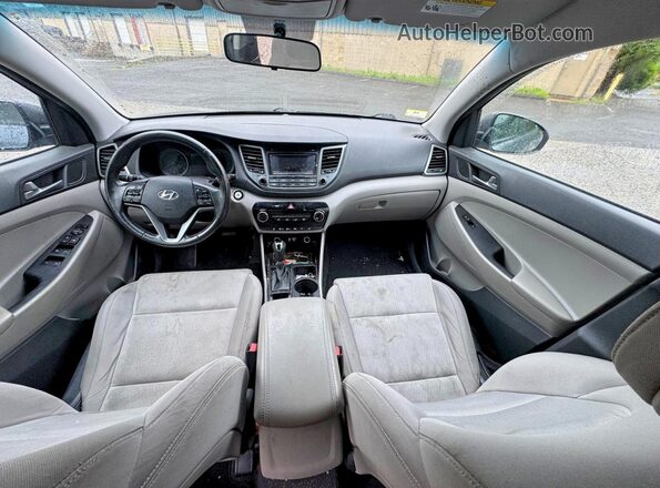 KM8J3CA2XGU194869 2016 HYUNDAI TUCSON Charcoal Rear seats view