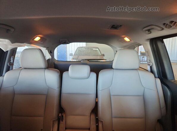 5FNRL5H64GB084209 2016 HONDA ODYSSEY Silver Rear seats view