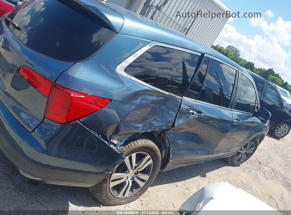 5FNYF5H50JB025112 2018 HONDA PILOT Blue Rear interior view