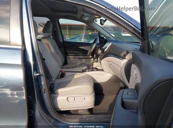 5FNYF5H54JB030300 2018 HONDA PILOT Turquoise Front interior view