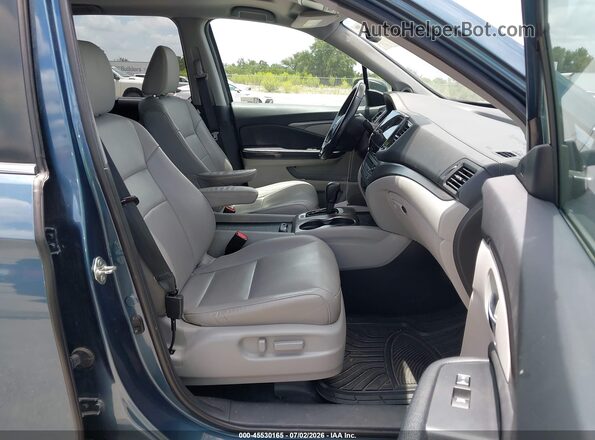 5FNYF5H5XKB027368 2019 HONDA PILOT Light Blue Front interior view