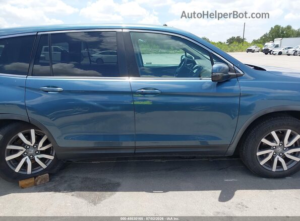 5FNYF5H5XKB027368 2019 HONDA PILOT Light Blue Rear interior view