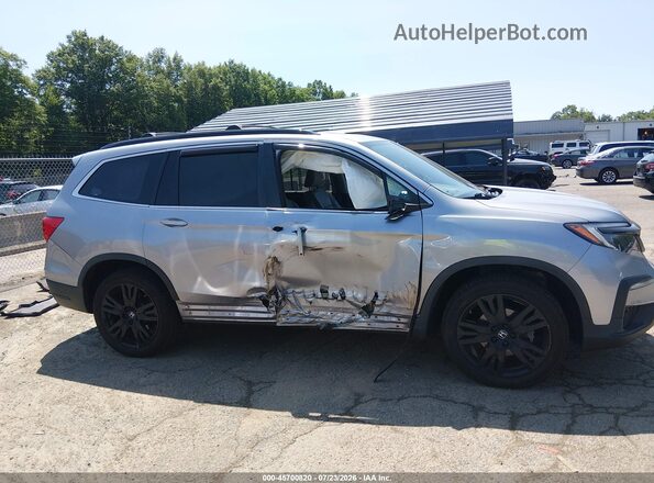 5FNYF6H28NB095233 2022 HONDA PILOT Silver Rear interior view