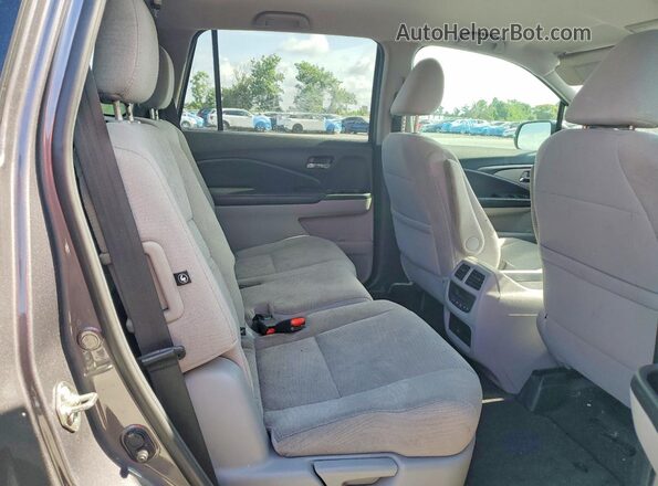 5FNYF6H36JB032909 2018 HONDA PILOT Gray Rear interior view