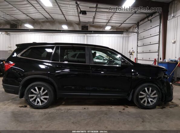 5FNYF6H55KB059876 2019 HONDA PILOT Black Rear interior view