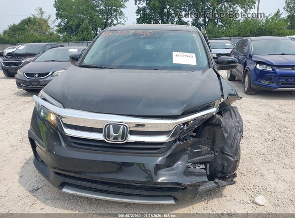 5FNYF6H55KB100006 2019 HONDA PILOT Black Rear interior view