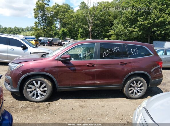 5FNYF6H58MB088243 2021 HONDA PILOT Burgundy Widok wnętrza z tyłu