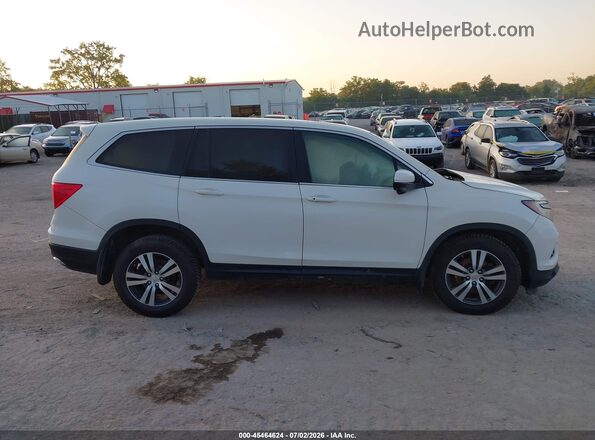 5FNYF6H89JB070047 2018 HONDA PILOT White Rear interior view