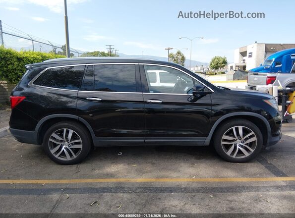 5FNYF6H93JB006417 2018 HONDA PILOT Black Rear interior view