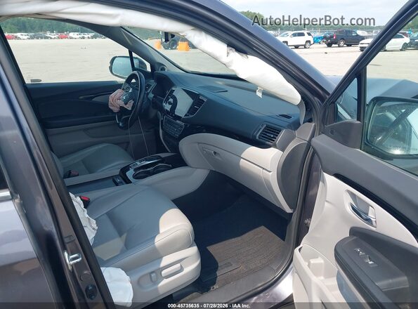 5FNYF6H95KB019512 2019 HONDA PILOT Gray Front interior view