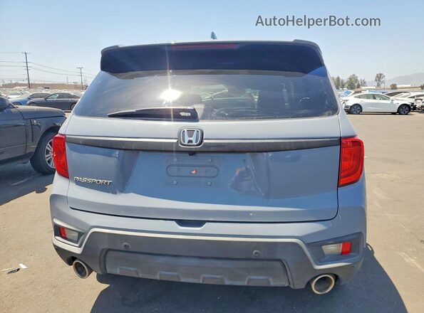 5FNYF7H50NB004956 2022 HONDA PASSPORT Gray Rear view