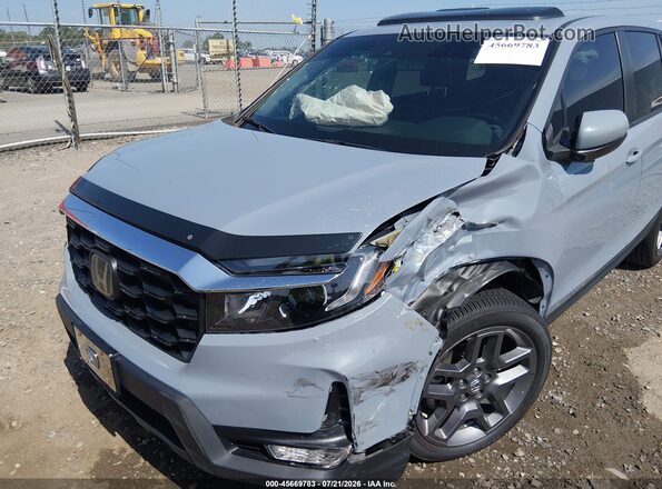5FNYF7H55NB003799 2022 HONDA PASSPORT Light Blue Widok z przodu