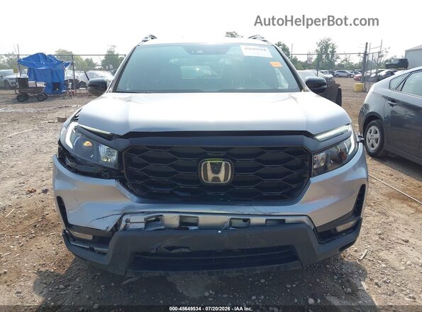 5FNYF8H06PB030393 2023 HONDA PASSPORT Gray Widok z przodu