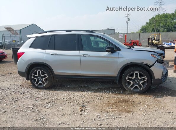 5FNYF8H06PB030393 2023 HONDA PASSPORT Gray Widok wnętrza z tyłu
