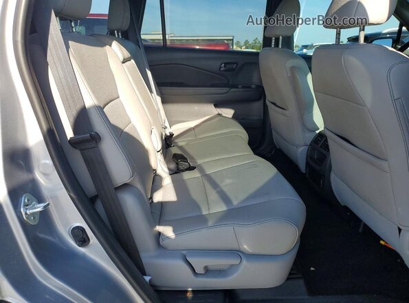 5FNYF8H59PB028942 2023 HONDA PASSPORT Серебряный Вид задней части салона