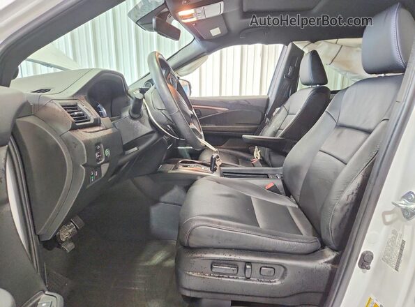 5FNYF8H59PB039312 2023 HONDA PASSPORT Белый Вид салона спереди