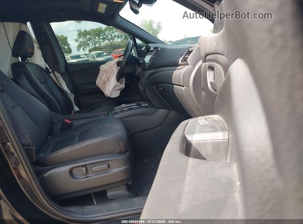 5FNYF8H61PB007138 2023 HONDA PASSPORT Black Front interior view